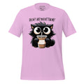 Pink t-shirt with a cat holding a drink graphic on a wooden surface, featuring the brand 'StayClothed'.