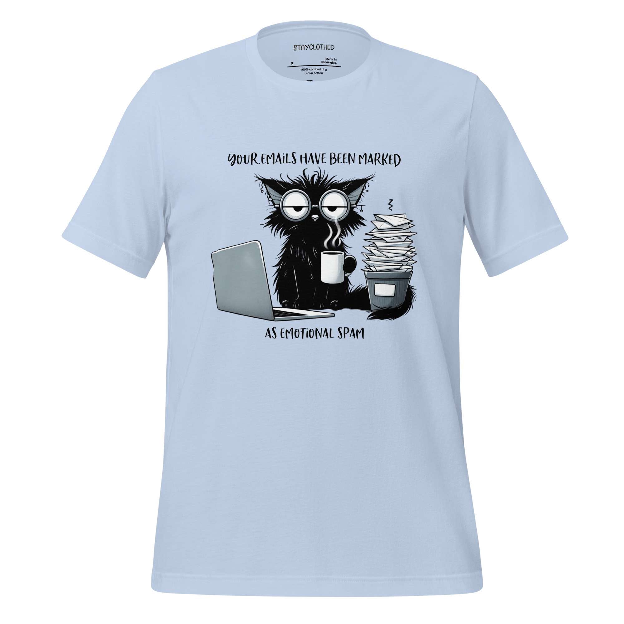 White t-shirt with a graphic of a cat and coffee cup on a wooden surface, featuring the brand 'StayClothed'.