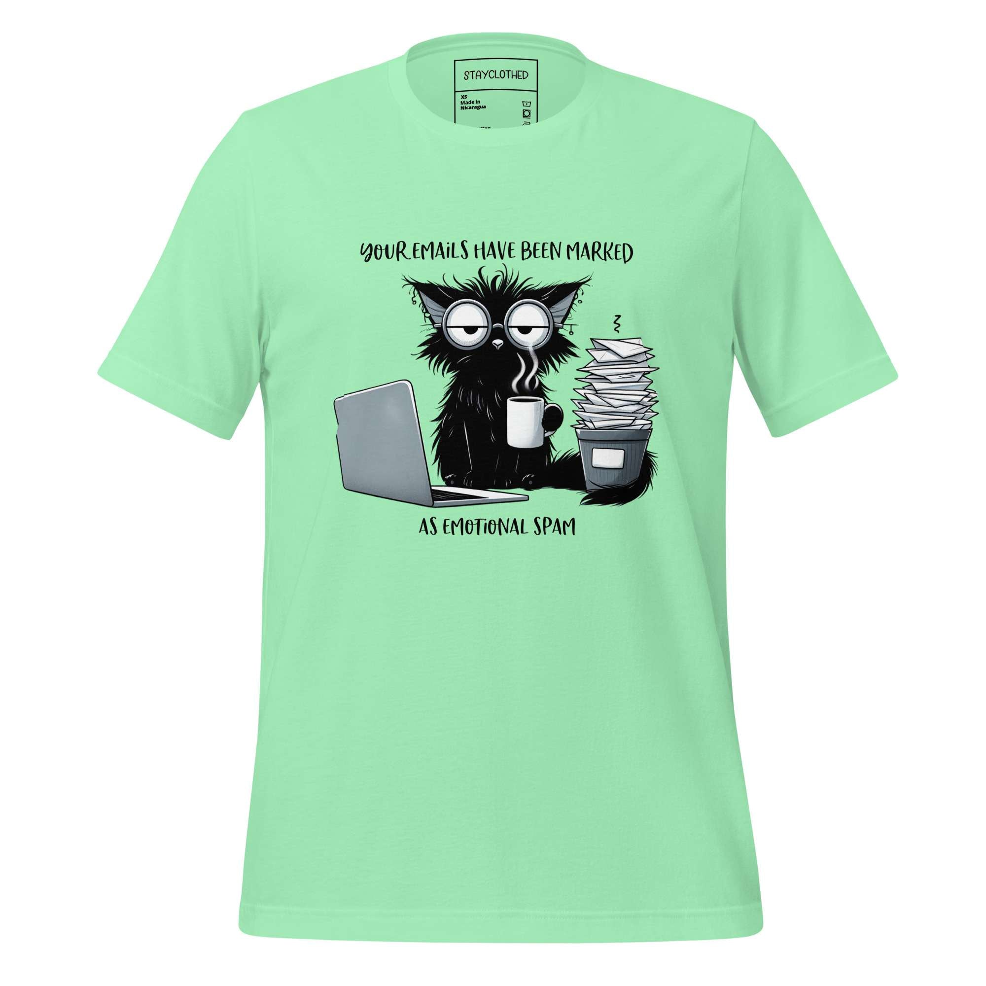 Light green t-shirt with a graphic of a cat and coffee cup on a wooden surface, featuring the brand 'StayClothed'.