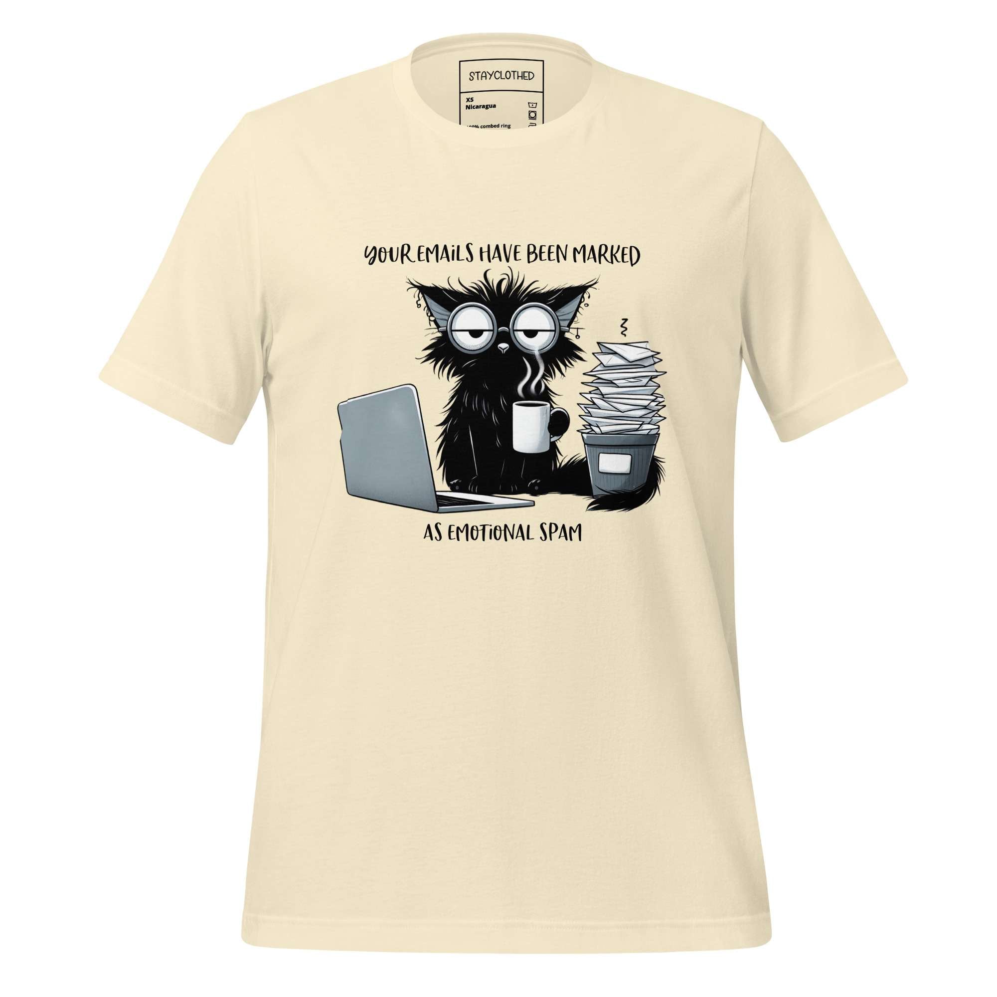 Beige t-shirt with a graphic of a cat and coffee cup on a wooden surface, featuring the brand 'StayClothed'.