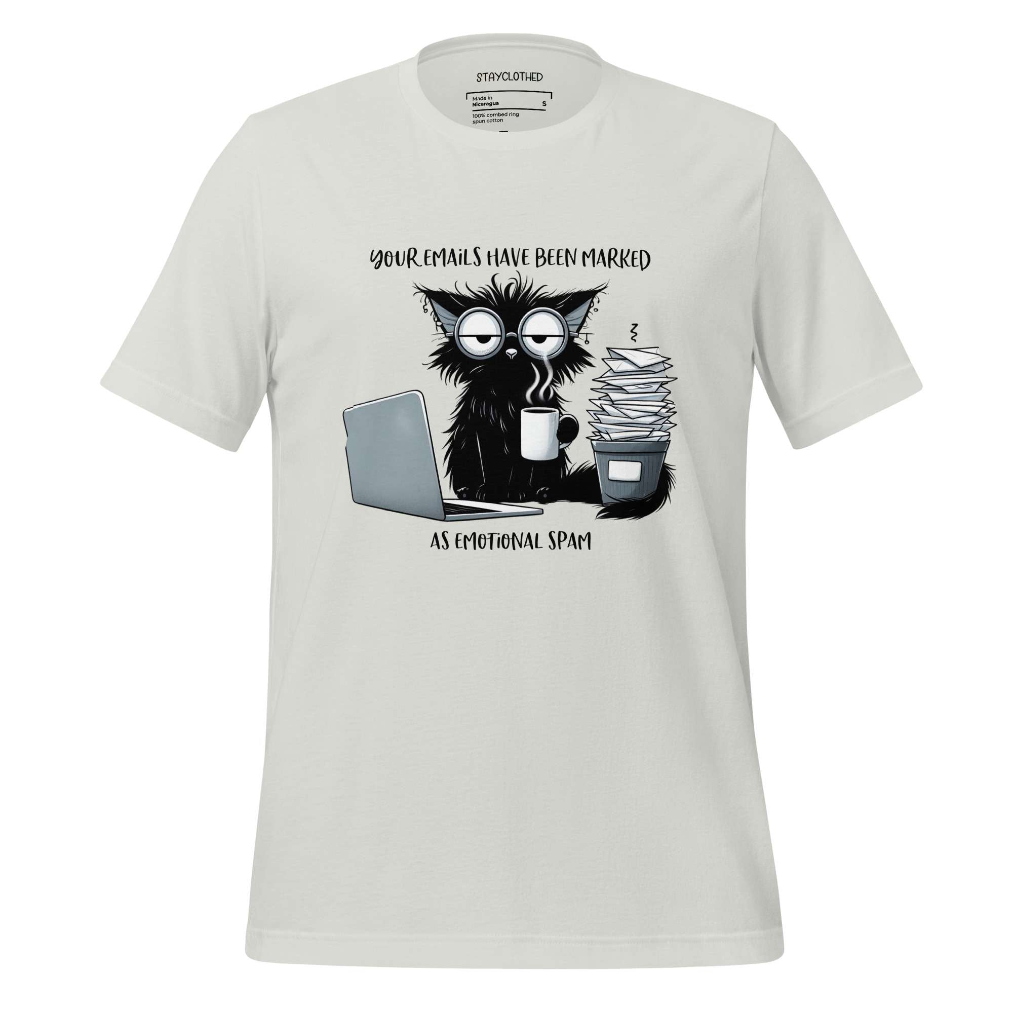 White t-shirt with a graphic design of a cat and text on a wooden surface, featuring the brand 'StayClothed'.