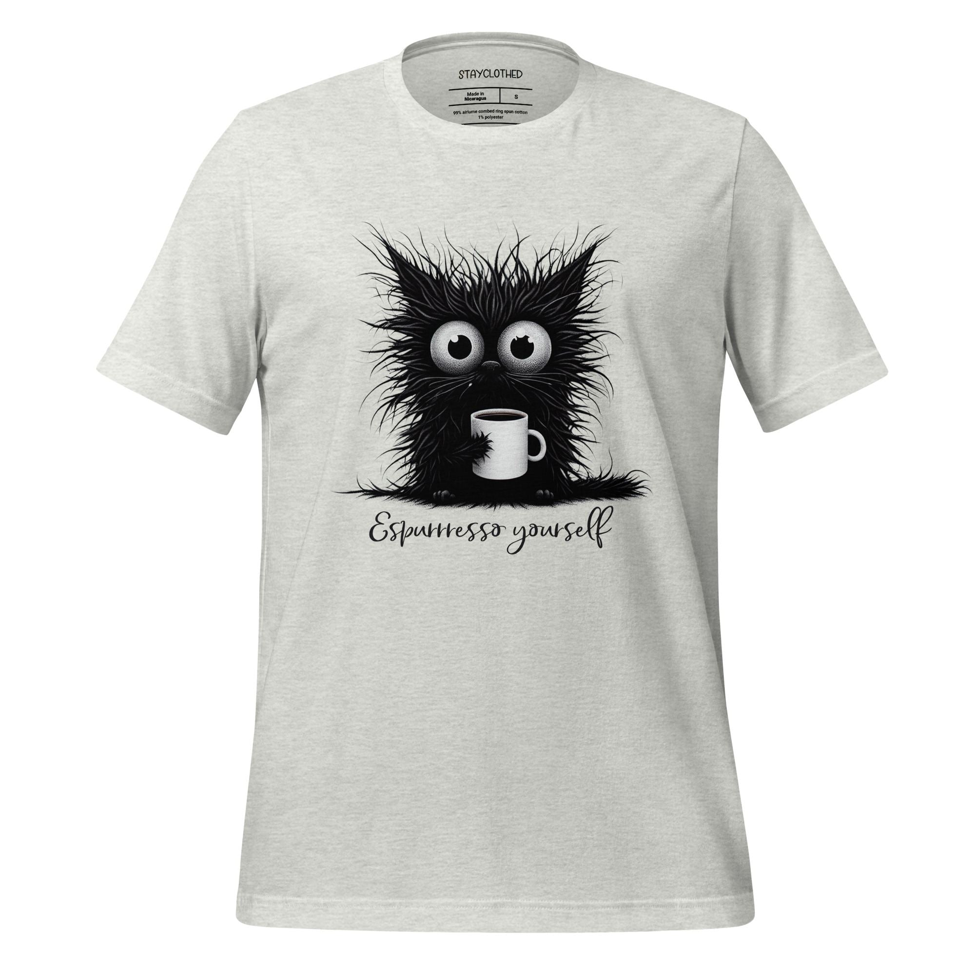 White t-shirt with a black cat graphic and 'Espressesso yourself' text on a wooden surface, with 'StayClothed' branding.