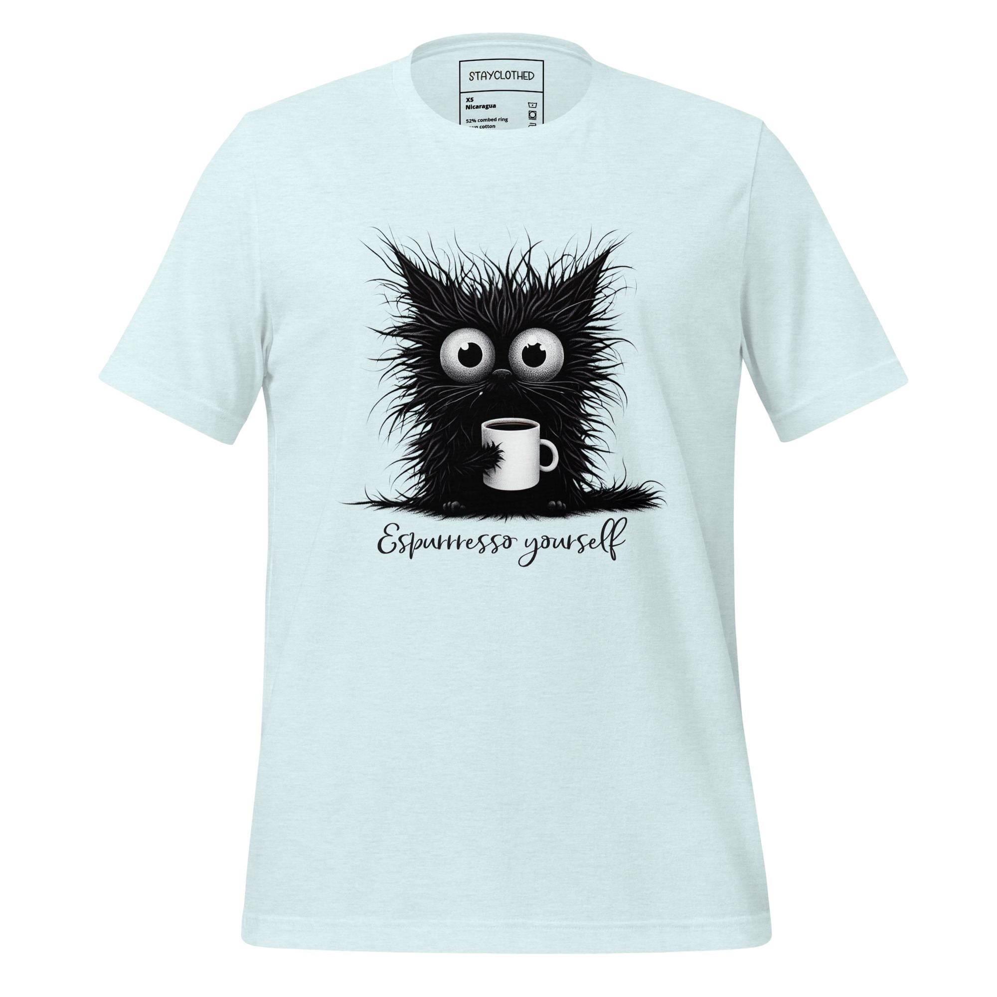 White t-shirt with a black cat graphic and 'Espressesso yourself' text on a wooden surface, featuring the brand 'StayClothed'.