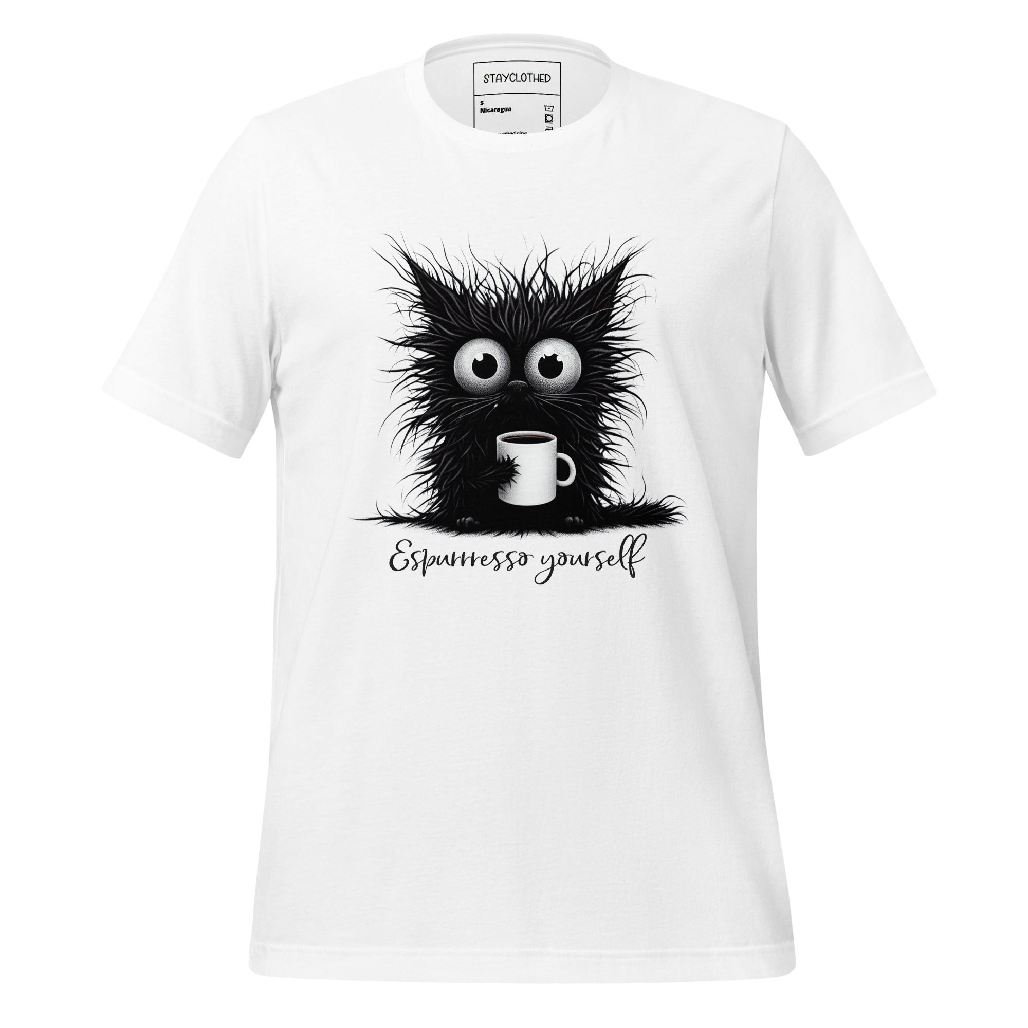 White t-shirt with a black cat graphic and 'Espressesso yourself' text on a wooden surface, featuring the brand 'StayClothed'.