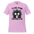 Pink t-shirt with a black cat graphic and text on a wooden surface, featuring the brand 'StayClothed'.