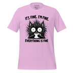 Pink t-shirt with a black cat graphic and text on a wooden surface, featuring the brand 'StayClothed'.