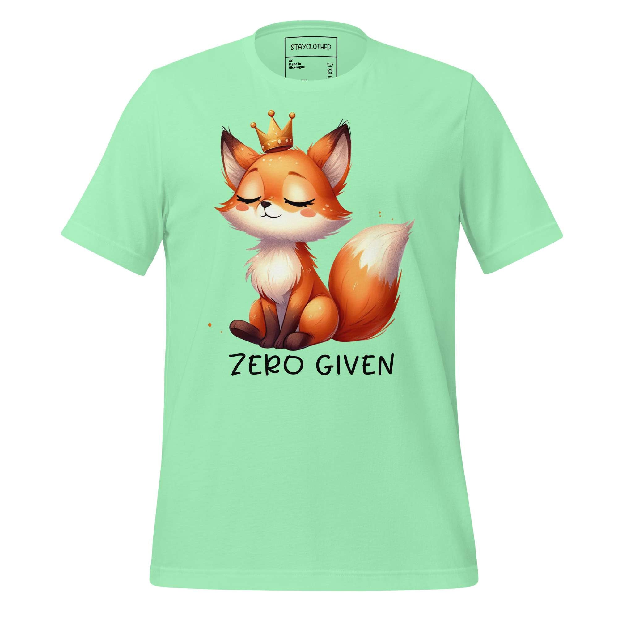 Light green t-shirt with a fox graphic and 'Zero Given' text on a wooden surface, branded 'StayClothed'.