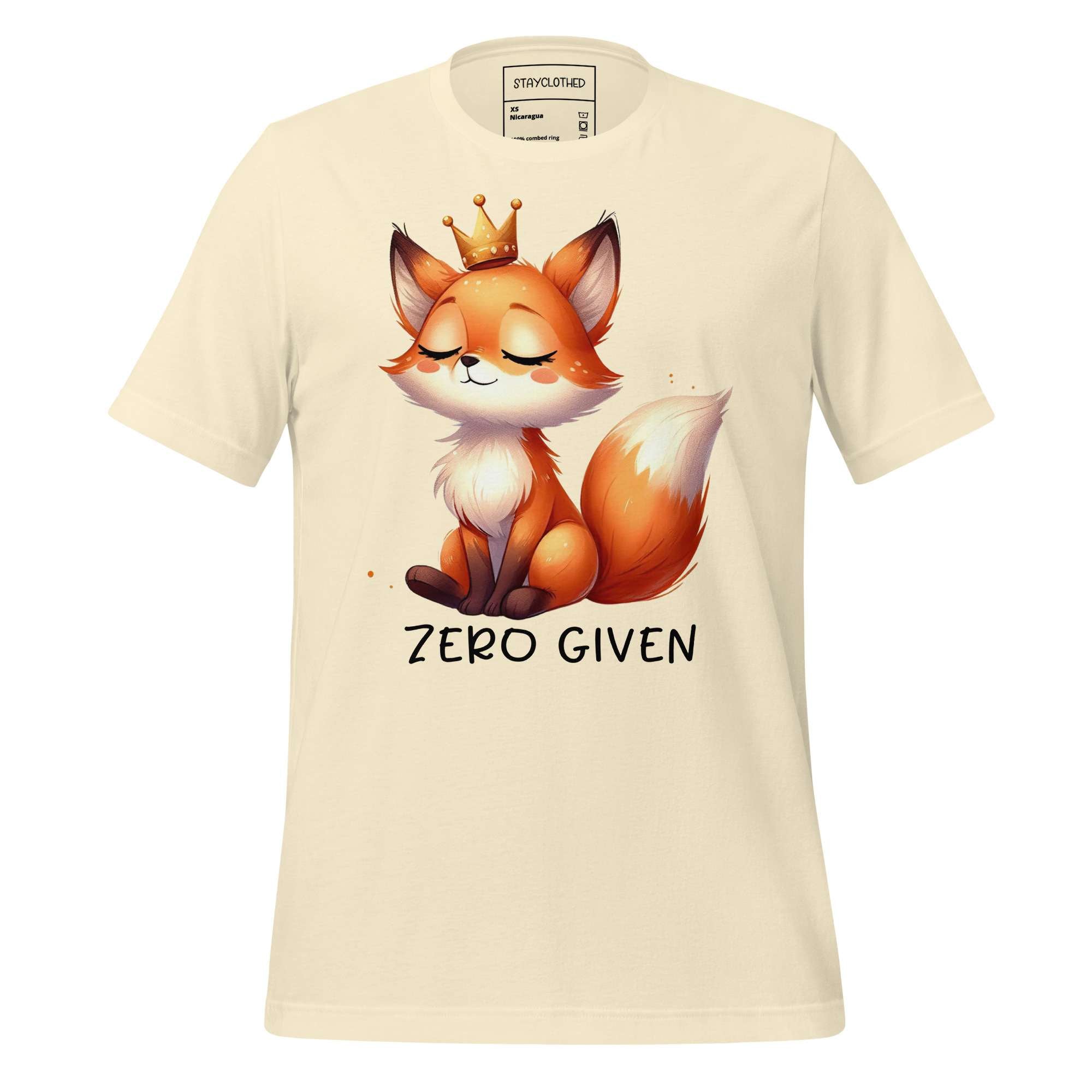 White t-shirt with a fox graphic and 'Zero Given' text on a wooden surface, featuring the brand 'StayClothed'.