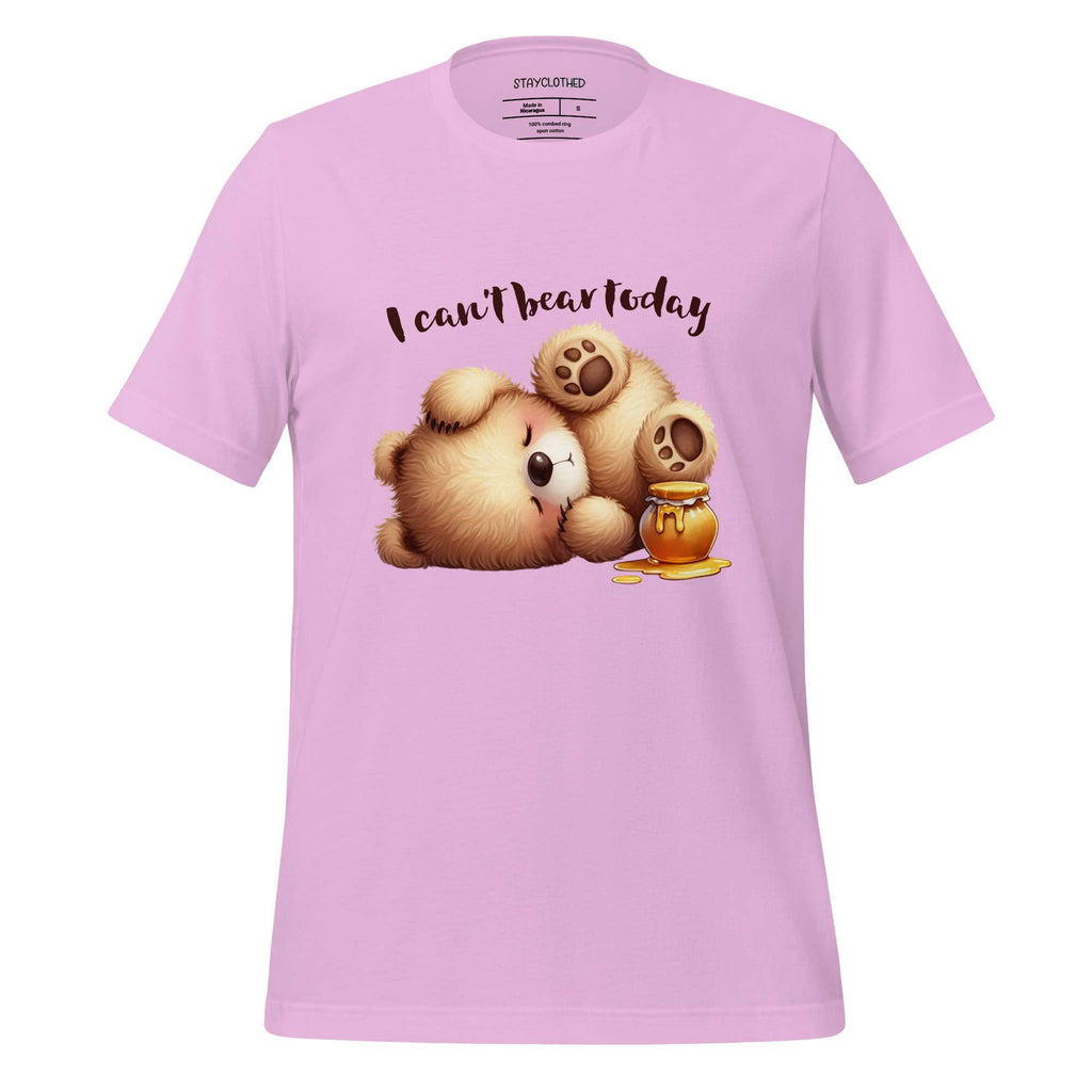 Pink t-shirt with teddy bear graphic and text 'I can't bear today' on a wooden surface, featuring the brand 'StayClothed'.