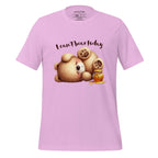 Pink t-shirt with teddy bear graphic and text 'I can't bear today' on a wooden surface, featuring the brand 'StayClothed'.