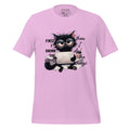 Pink t-shirt with a cat graphic and text on a wooden surface, featuring the brand 'StayClothed'.