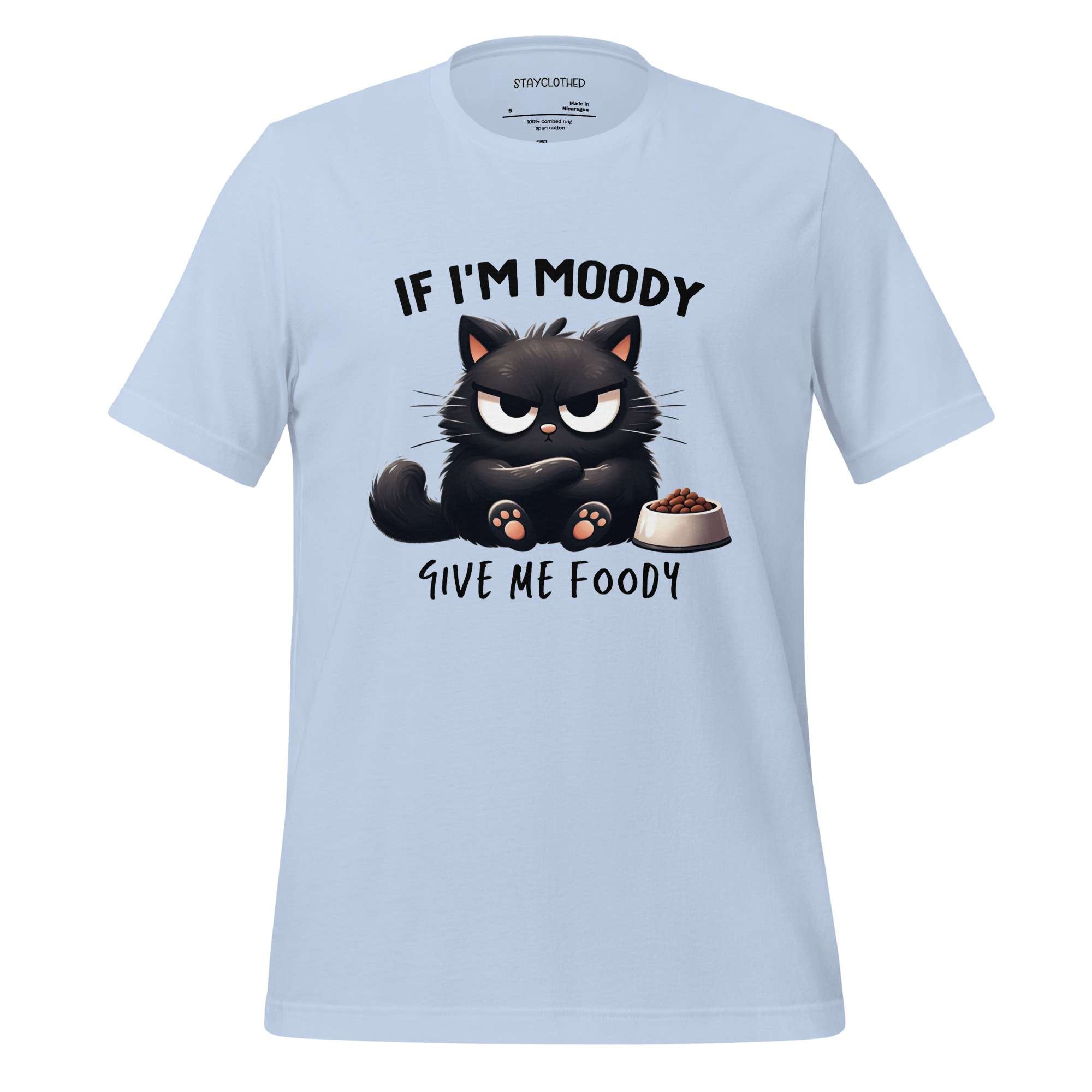 White t-shirt with a black cat graphic and text on a wooden surface, featuring the brand 'StayClothed'.