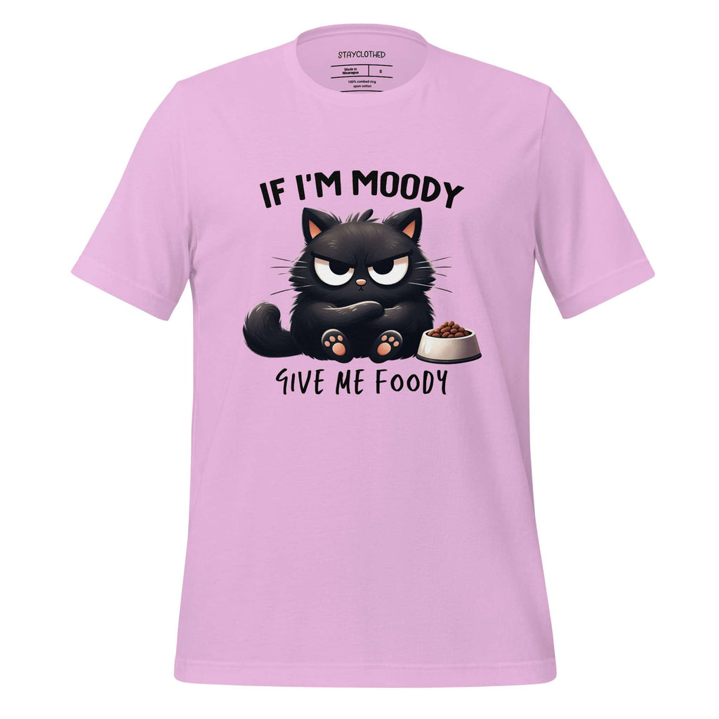 Pink t-shirt with a black cat graphic and text on a wooden surface, featuring the brand 'StayClothed'.