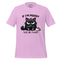 Pink t-shirt with a black cat graphic and text on a wooden surface, featuring the brand 'StayClothed'.