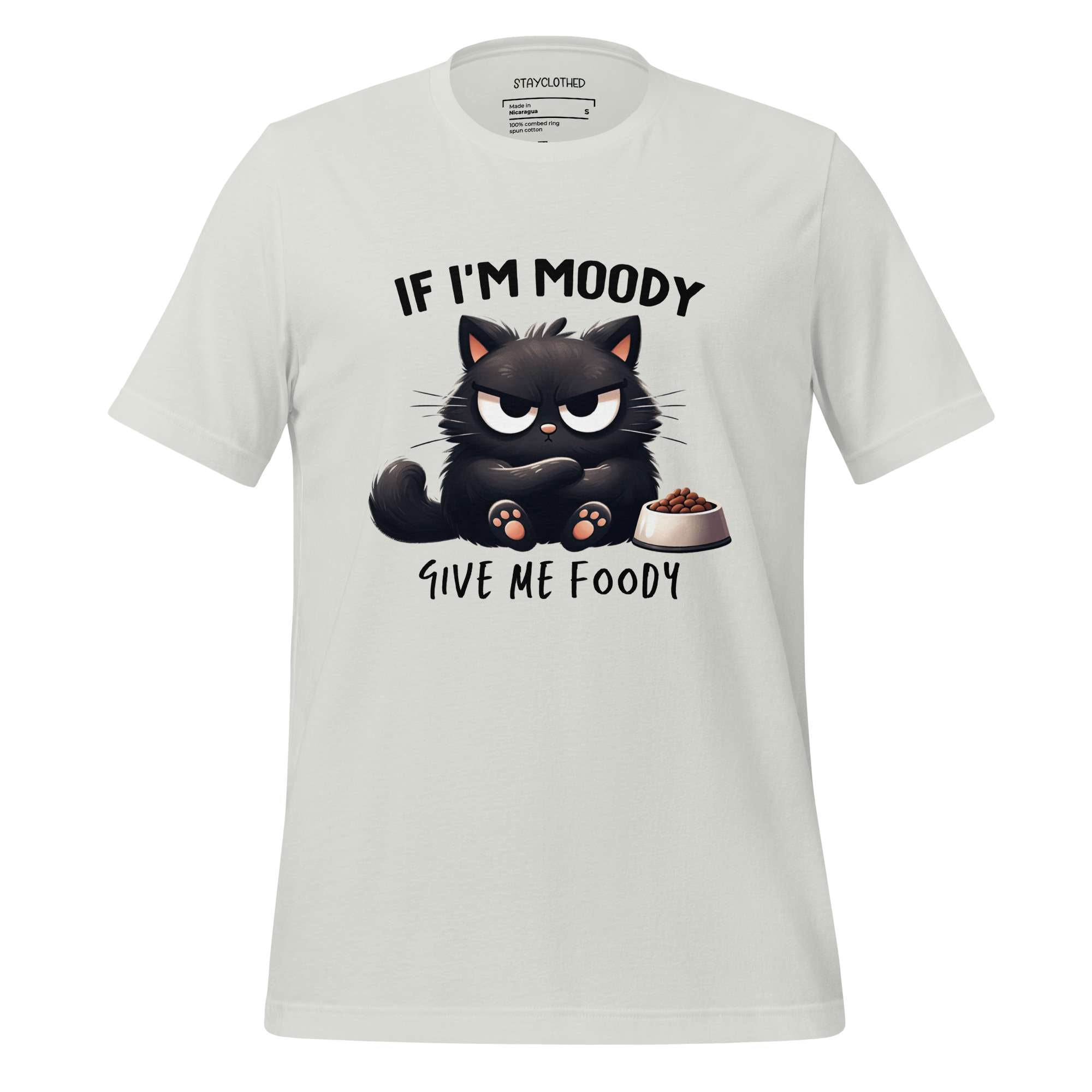 White t-shirt with a black cat graphic and text on a wooden surface, featuring the brand 'StayClothed'.