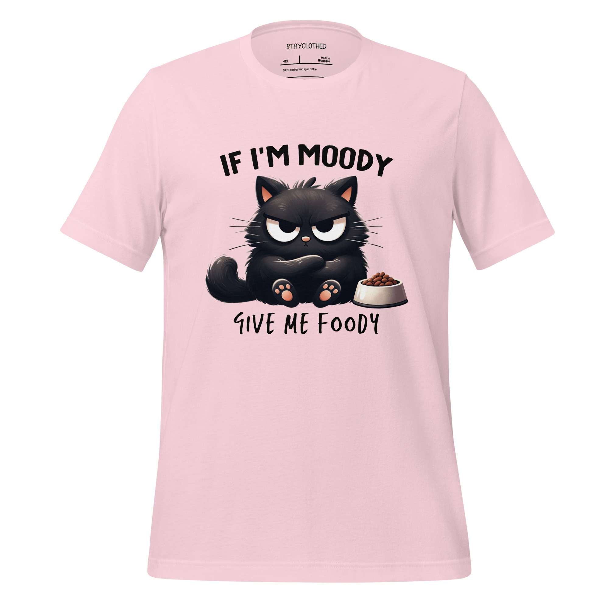 Pink t-shirt with a black cat graphic and text on a wooden surface, featuring the brand 'StayClothed'.