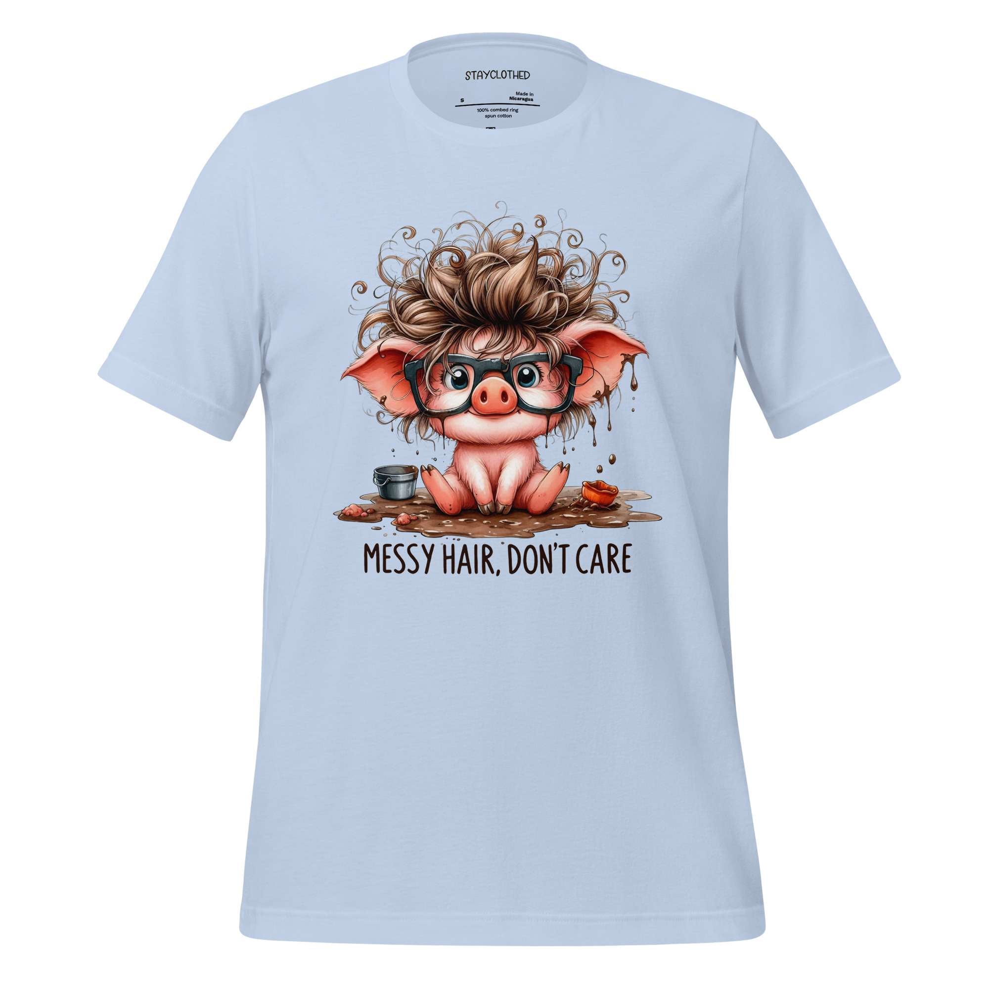 White t-shirt with a cartoon pig design and 'StayClothed' branding on a wooden surface.