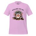 Pink t-shirt with a cartoon pig design and text 'Messy hair, don't care' on a wooden surface.