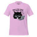 Pink t-shirt with a black cat graphic and text on a wooden surface, featuring the brand 'StayClothed'.