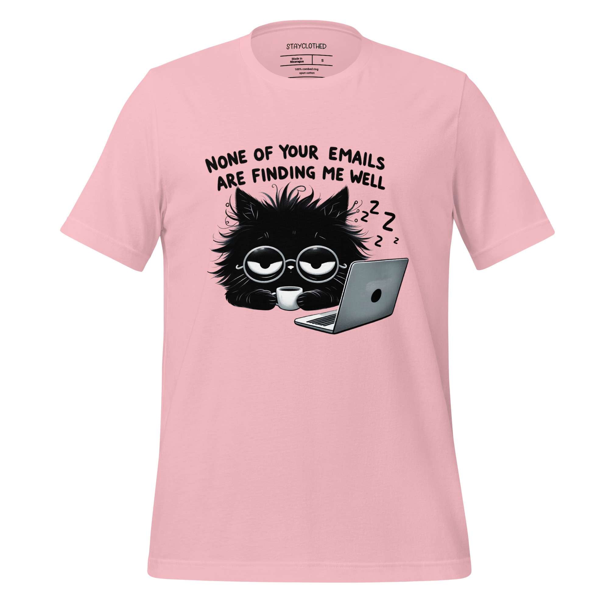 Pink t-shirt with a black cat graphic and text on a wooden surface, featuring the brand 'StayClothed'.