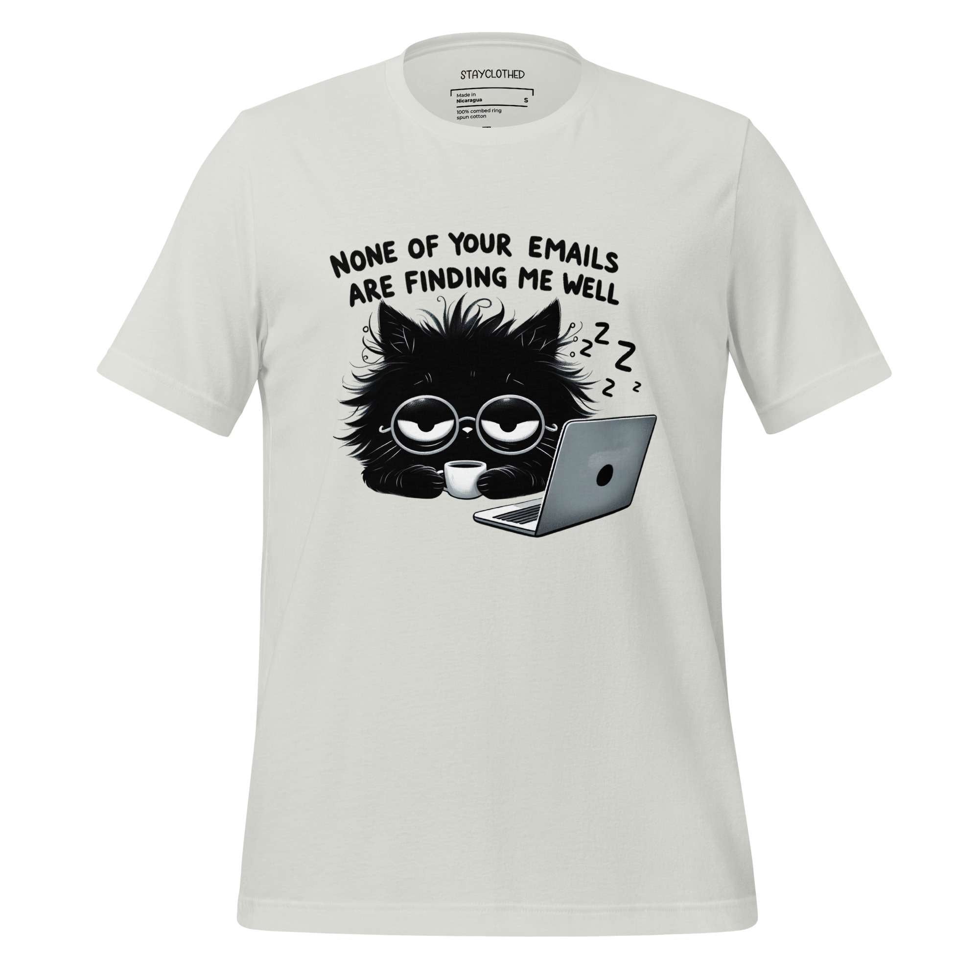 White t-shirt with a black cat graphic and text on a wooden surface, featuring the brand 'StayClothed'.