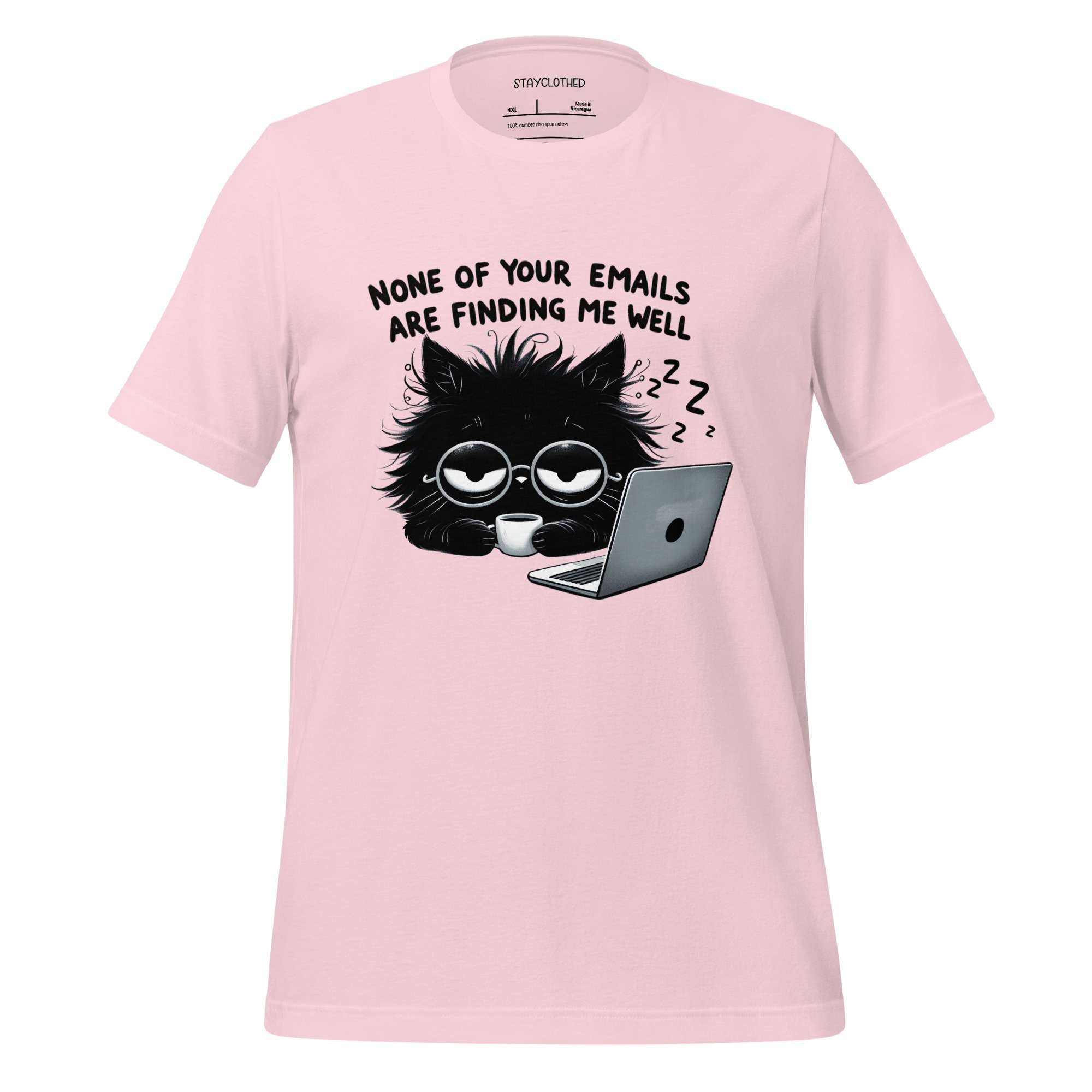 Pink t-shirt with a black cat graphic and text on a wooden surface, featuring the brand 'StayClothed'.