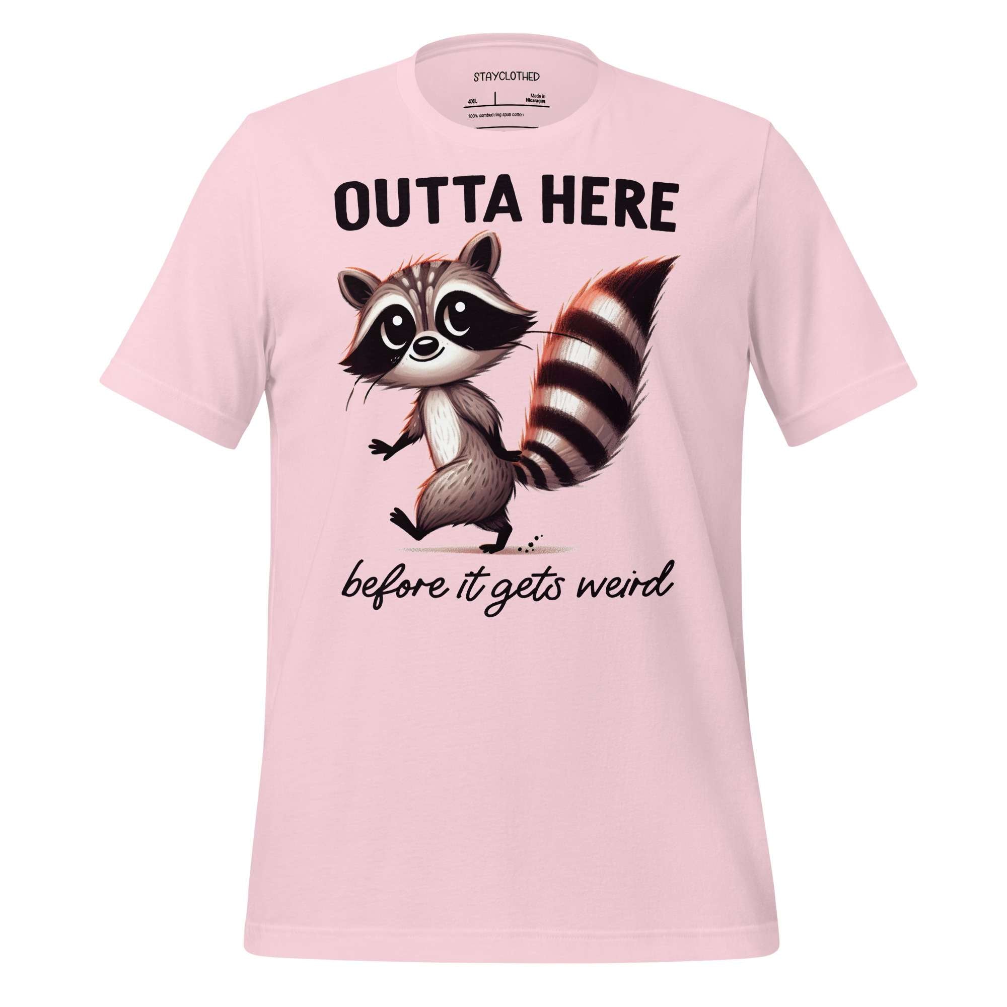 Pink t-shirt with a raccoon graphic and text on a wooden surface, featuring the brand 'StayClothed'.