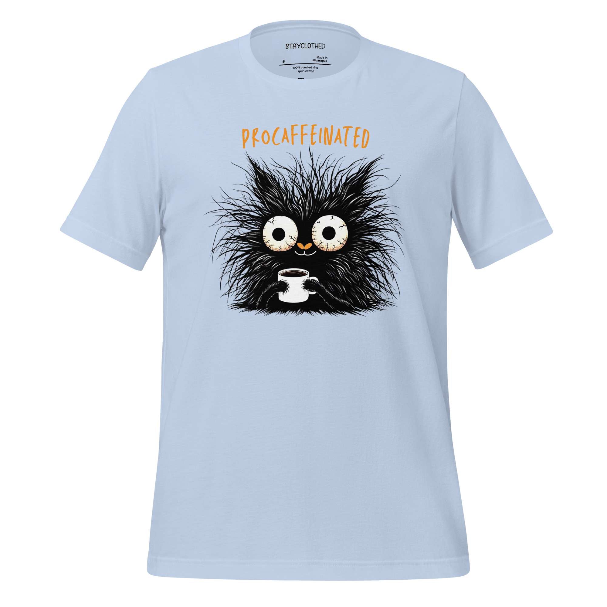 White t-shirt with a cartoon character holding a coffee cup on a wooden surface, featuring the brand 'StayClothed'.