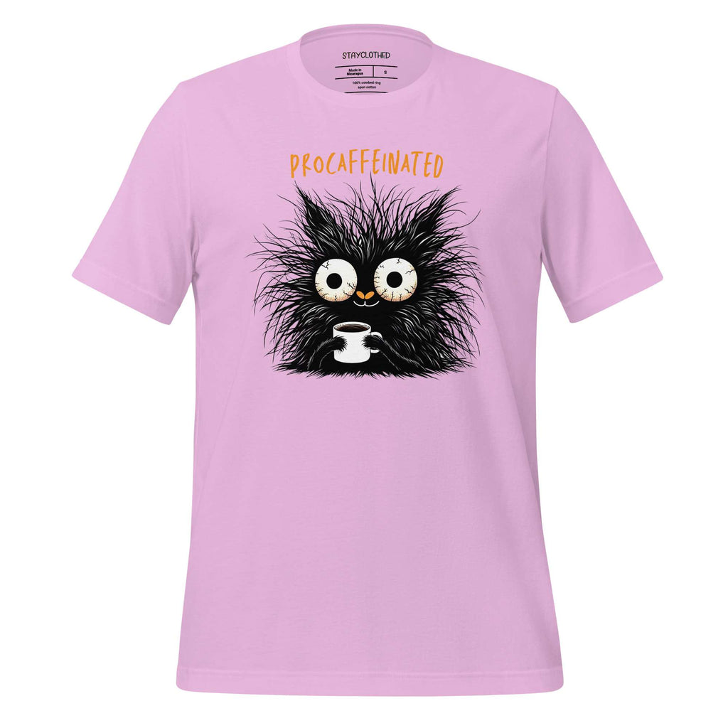 Pink t-shirt with a cartoon cat holding a coffee cup on a wooden surface, featuring the brand 'StayClothed'.