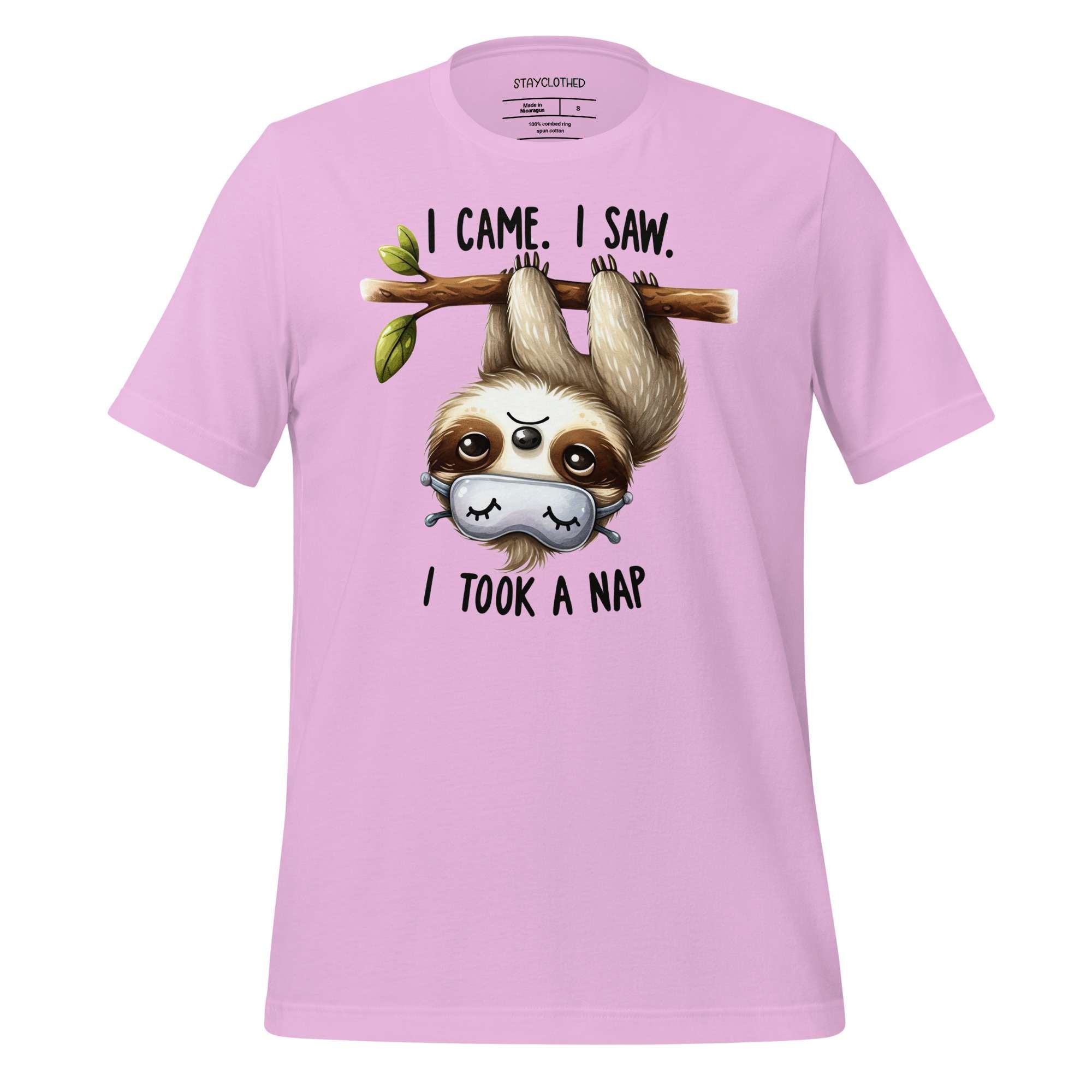 Pink t-shirt with a sloth graphic and text on a wooden surface, featuring the brand 'StayClothed'.