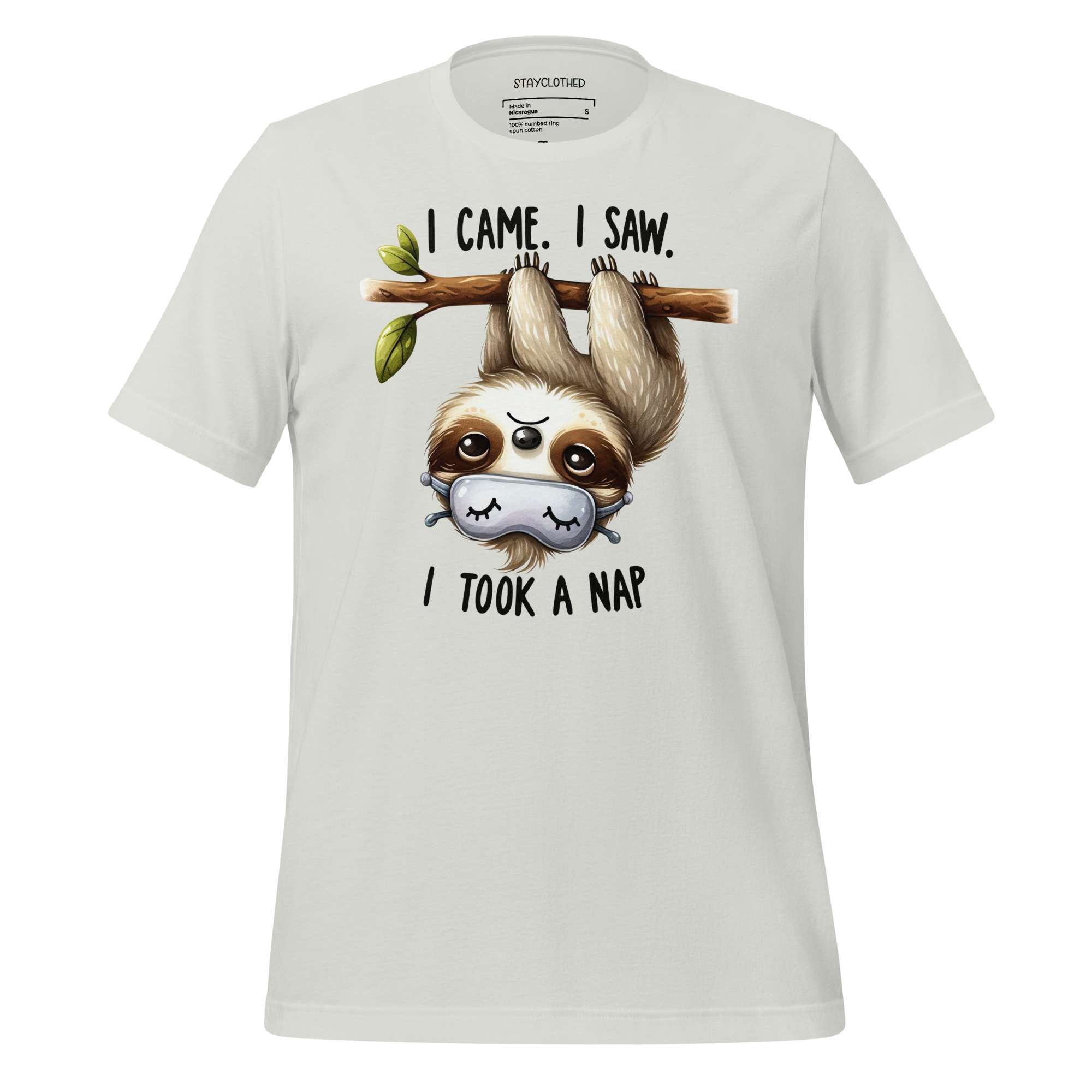 White t-shirt with a sloth graphic and text on a wooden surface, featuring the brand 'StayClothed'.