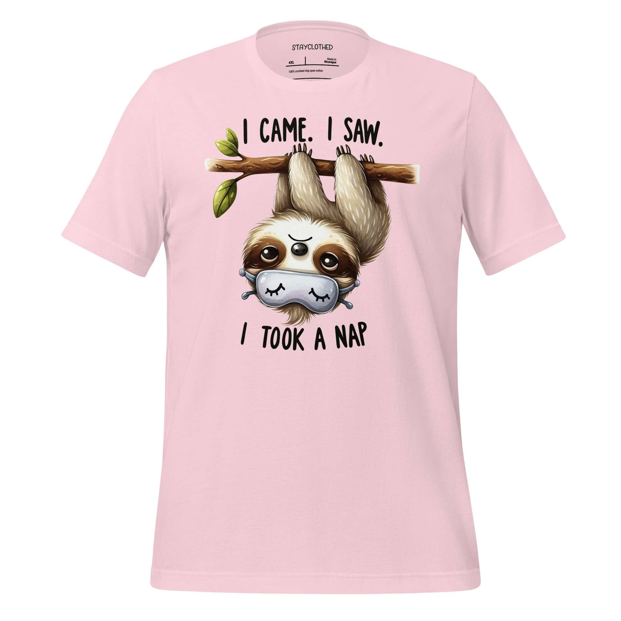 Pink t-shirt with a sloth graphic and text on a wooden surface, featuring the brand 'StayClothed'.