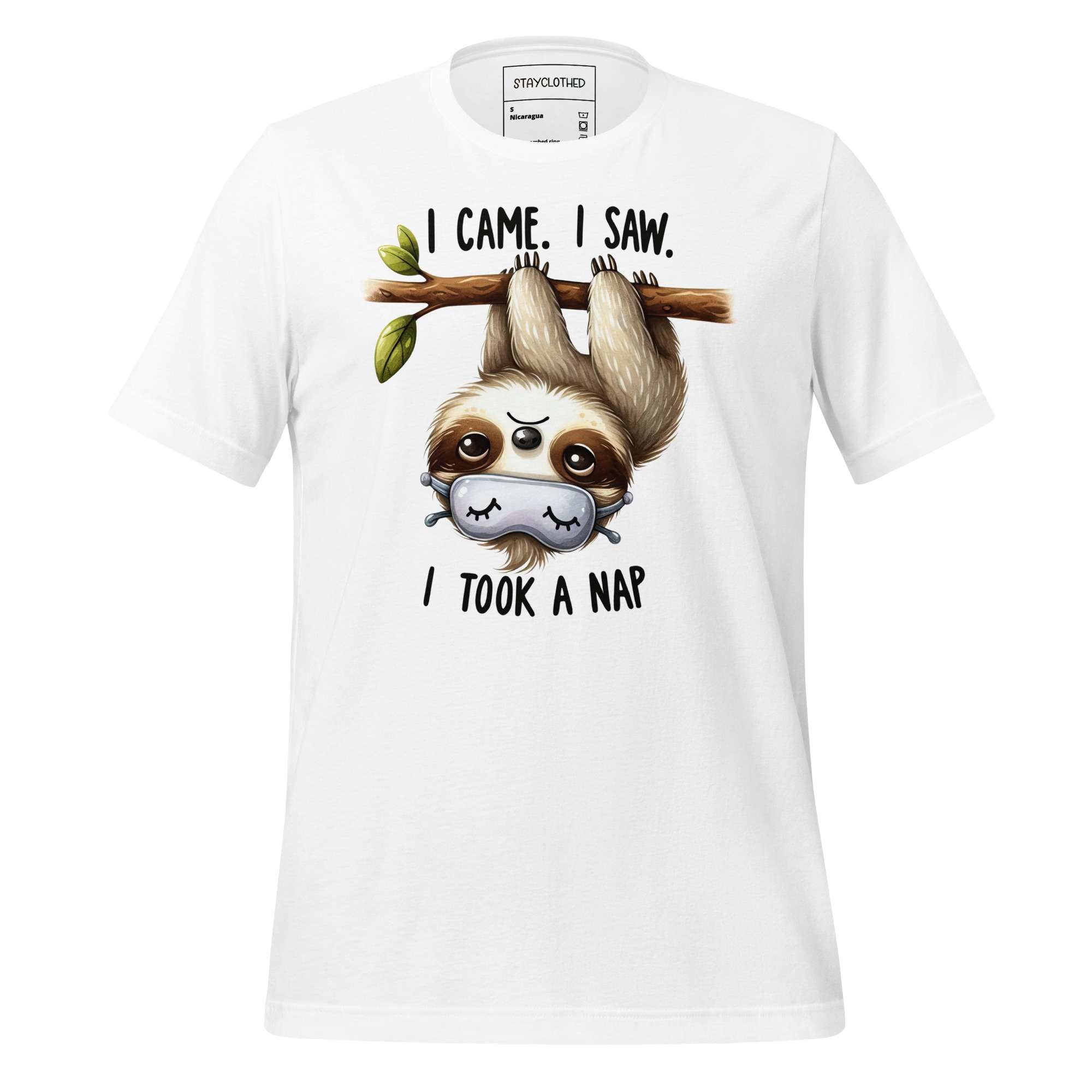 White t-shirt with a sloth graphic and text on a wooden surface, featuring the brand 'StayClothed'.
