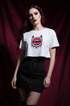 Model wearing the Gothic Rose Lips Crop Top with black trousers in a burgundy studio scene