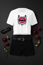 Gothic Rose Lips Crop Top flat lay styled with black trousers and red roses
