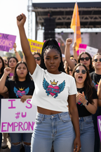 Model wearing the GRL PWR Winged Heart Crop Top at an empowerment rally scene
