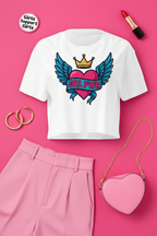 GRL PWR Winged Heart Crop Top flat lay styled with pink trousers and heart accessories