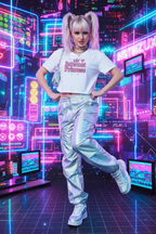 Model wearing the Internet Princess Crop Top in a colourful neon arcade scene