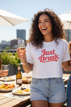 Model wearing the retro script crop top outdoors with denim shorts