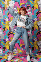 Model wearing the Made in 1995 Icon Era Crop Top in a colourful pop art studio scene