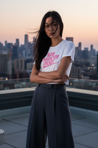 Model wearing the Main Character Energy Crop Top on a rooftop with a city skyline