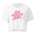 Main Character Energy white crop top front product mockup with bold pink statement text