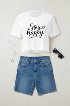 Stay Happy Cropped Festival Top flat lay styled with a denim skirt and casual accessories