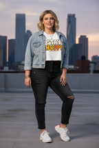 Model wearing the Stay Happy Women’s Crop Top with a city skyline backdrop