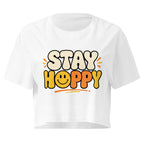Stay Happy Women’s white crop top front product mockup with yellow bubble text graphic