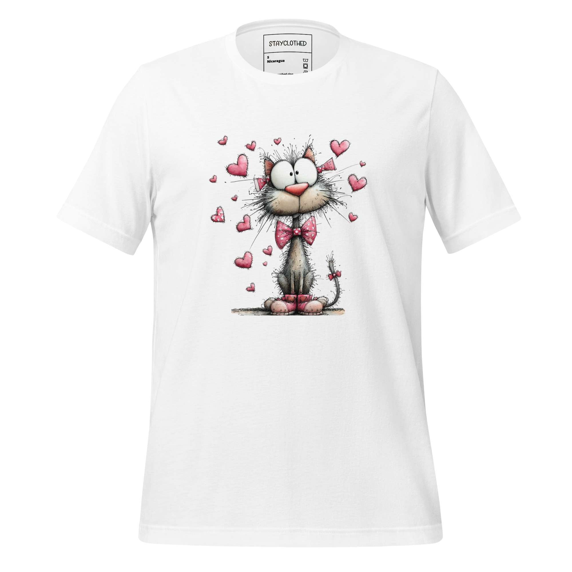 White t-shirt with a cartoon cat design on a wooden surface, featuring the brand 'StayClothed'.