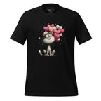 Black t-shirt with a cat and heart balloons design on a wooden surface, featuring the brand 'StayClothed'.