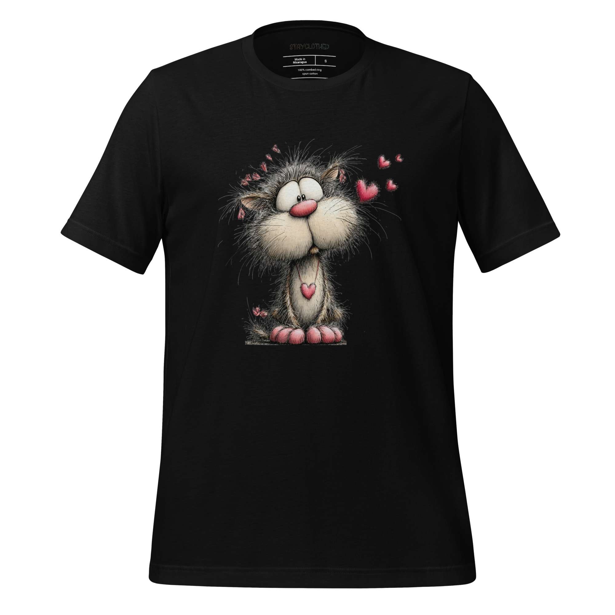 Black t-shirt with a cartoon cat design on a wooden surface, featuring the brand 'StayClothed'.