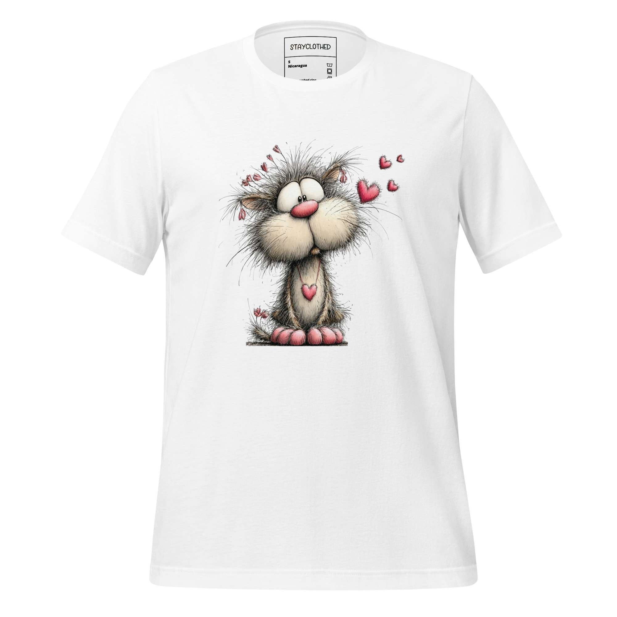 White t-shirt with cartoon cat design on a wooden surface, featuring 'StayClothed' brand.