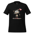 Black t-shirt with a cat graphic and 'StayClothed' branding on a wooden surface.